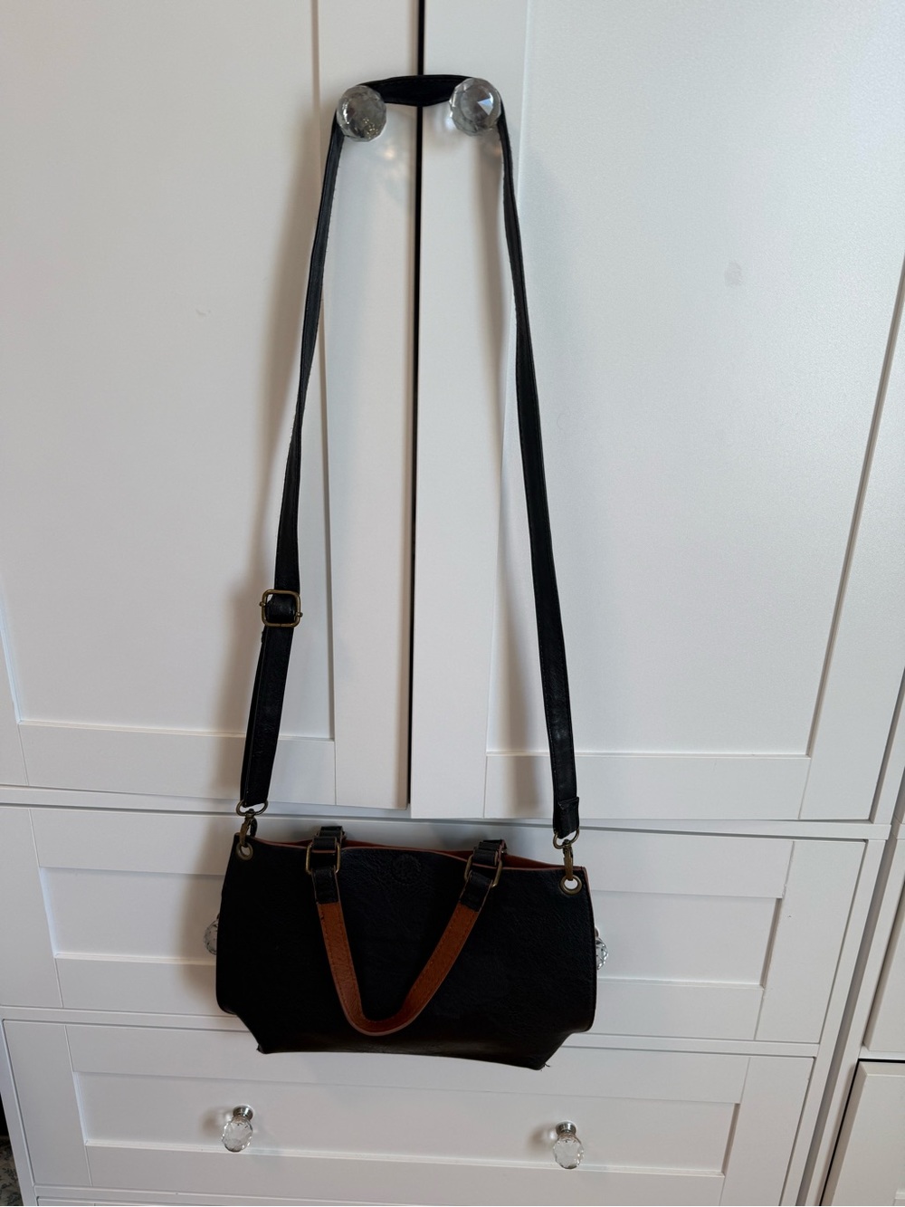Versatile Black Crossbody Bag with Brown Accent Handles